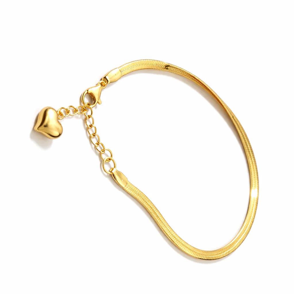 Gold-tone snake bracelet with heart charm and adjustable link chain