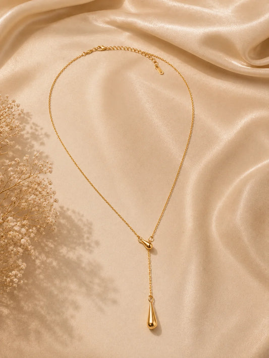 Gold teardrop pendant necklace on a slim chain with small bead loops