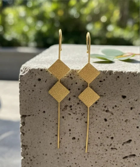 Gold-tone textured square ear cuffs with long dangling pins