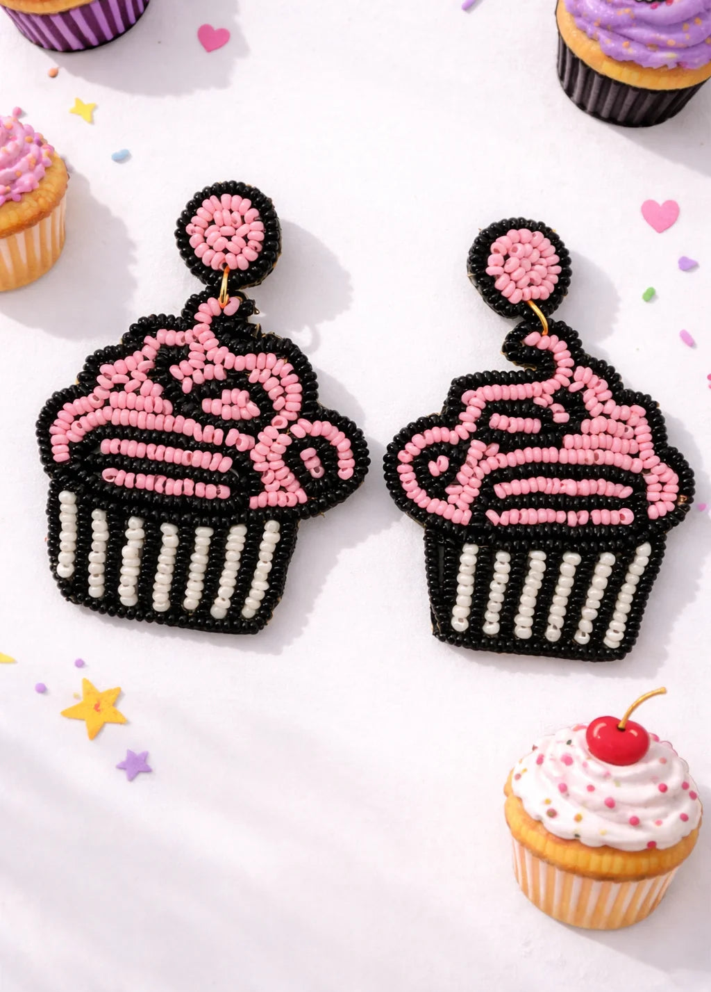 Pair of beaded cupcake dangle earrings with pink frosting and black beadwork