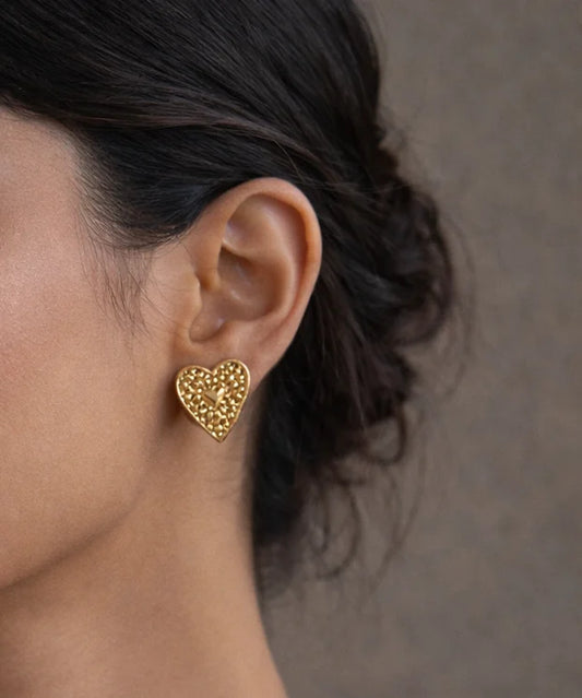 Heart stud earrings, textured gold-tone heart on ear