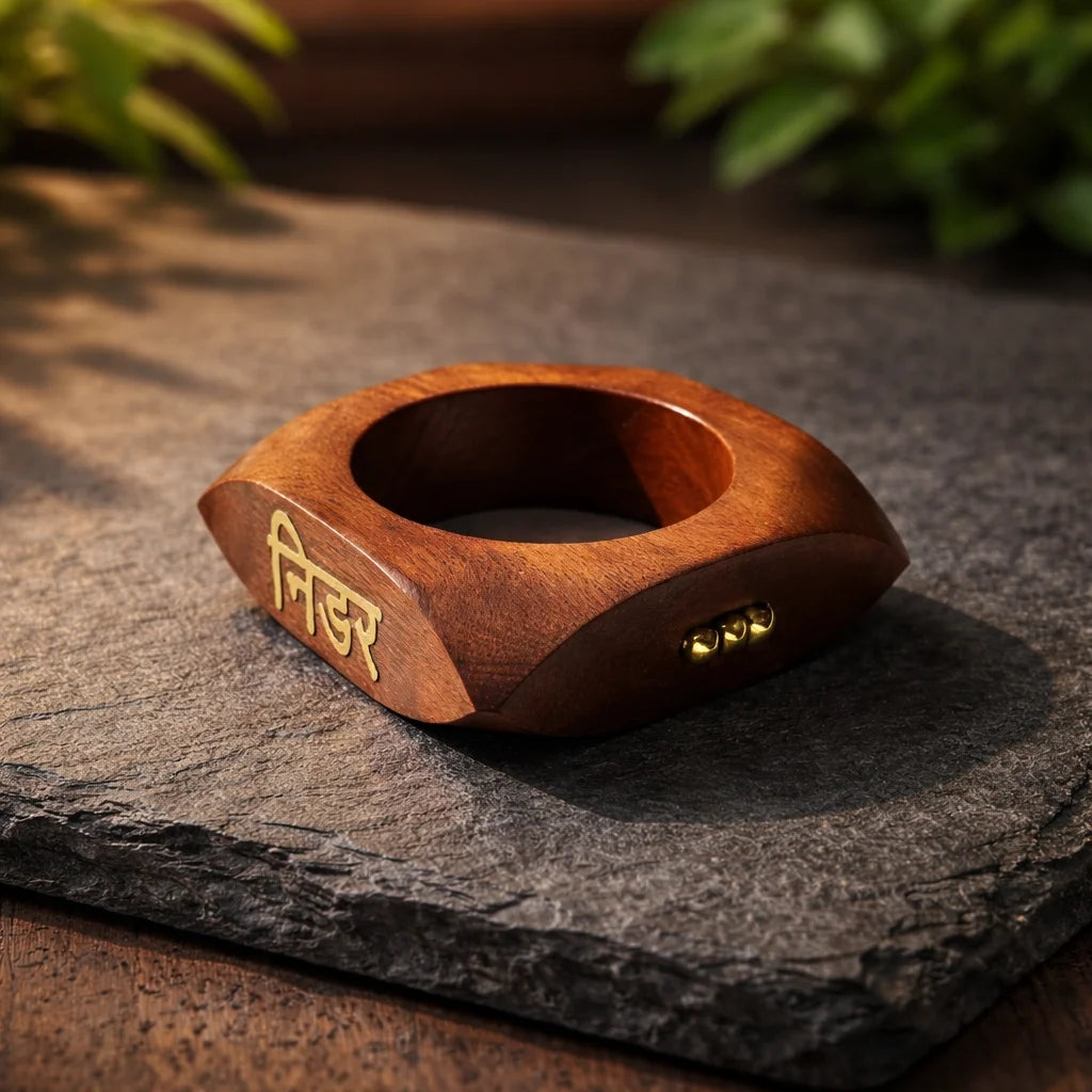 Brown wooden kada with engraved pattern and small brass rivets