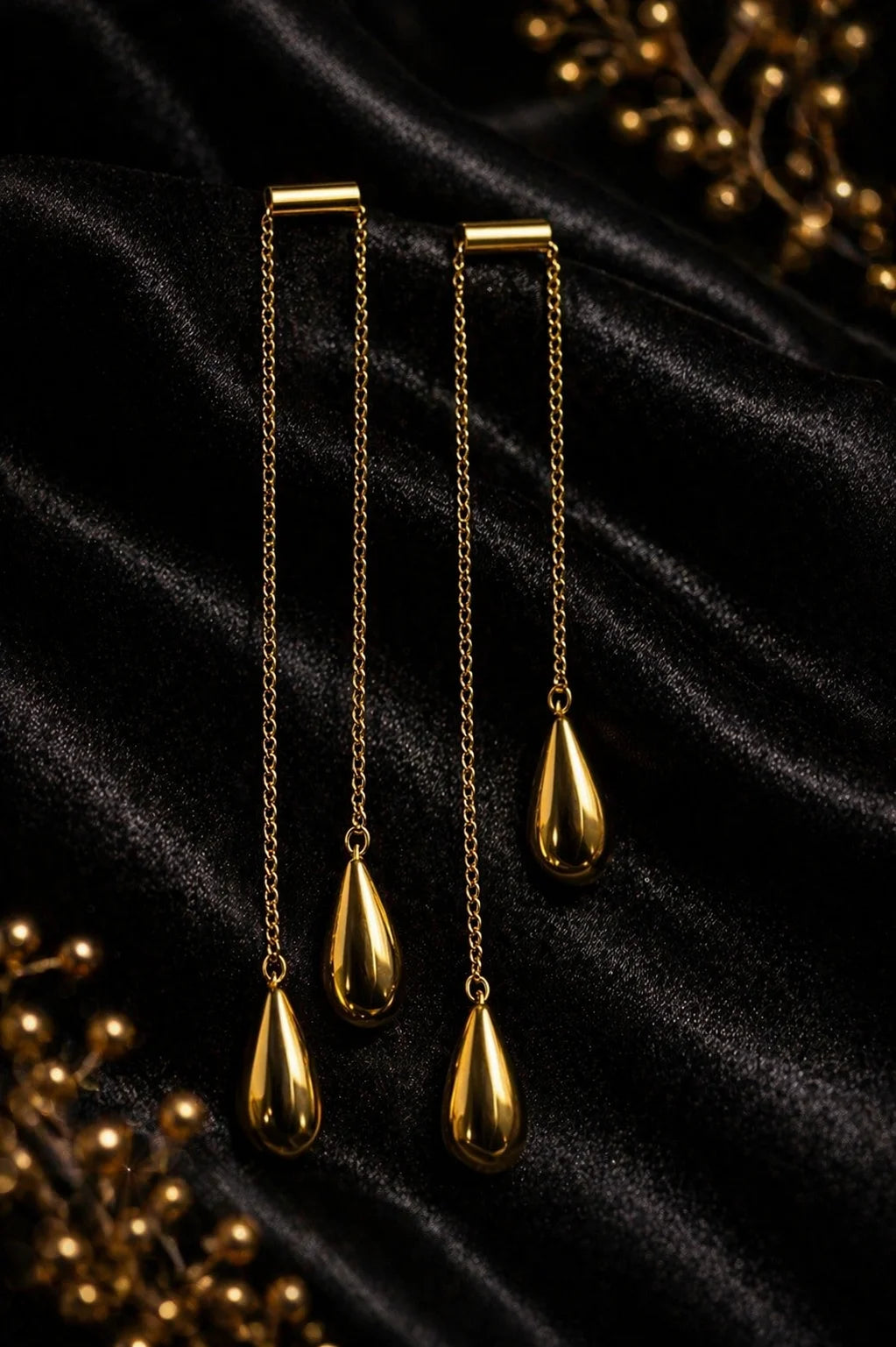 Tear-drop statement earrings with gold-plated teardrop pendants