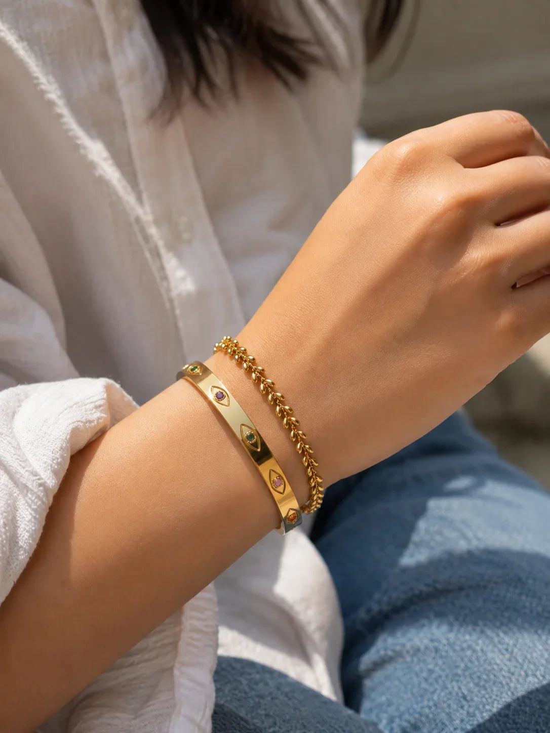 Gold beaded bracelet with multicolor oval charms and chain link