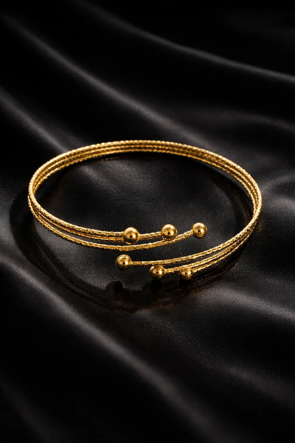 Gold arm cuff bracelet with triple wrap and small ball beads, adjustable fit