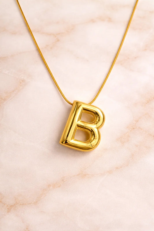 Letter B pendant necklace with gold-tone chain and polished B charm