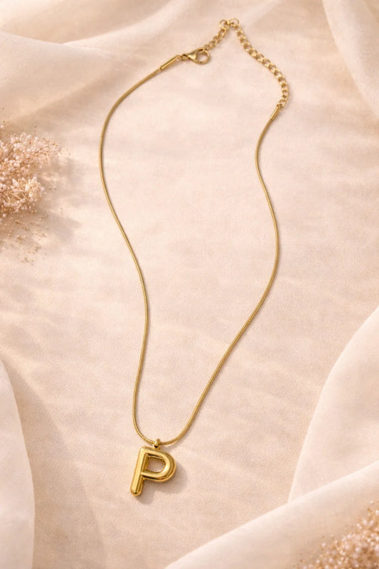 Letter P pendant necklace with gold-tone chain and outlined P charm