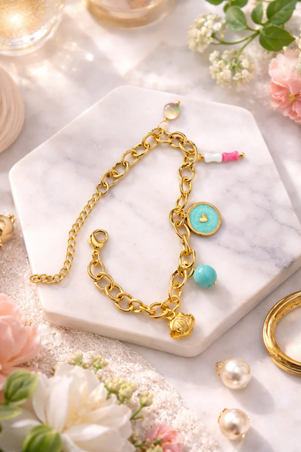 Gold chain charms bracelet with turquoise heart pendant, blue ball and pink bead