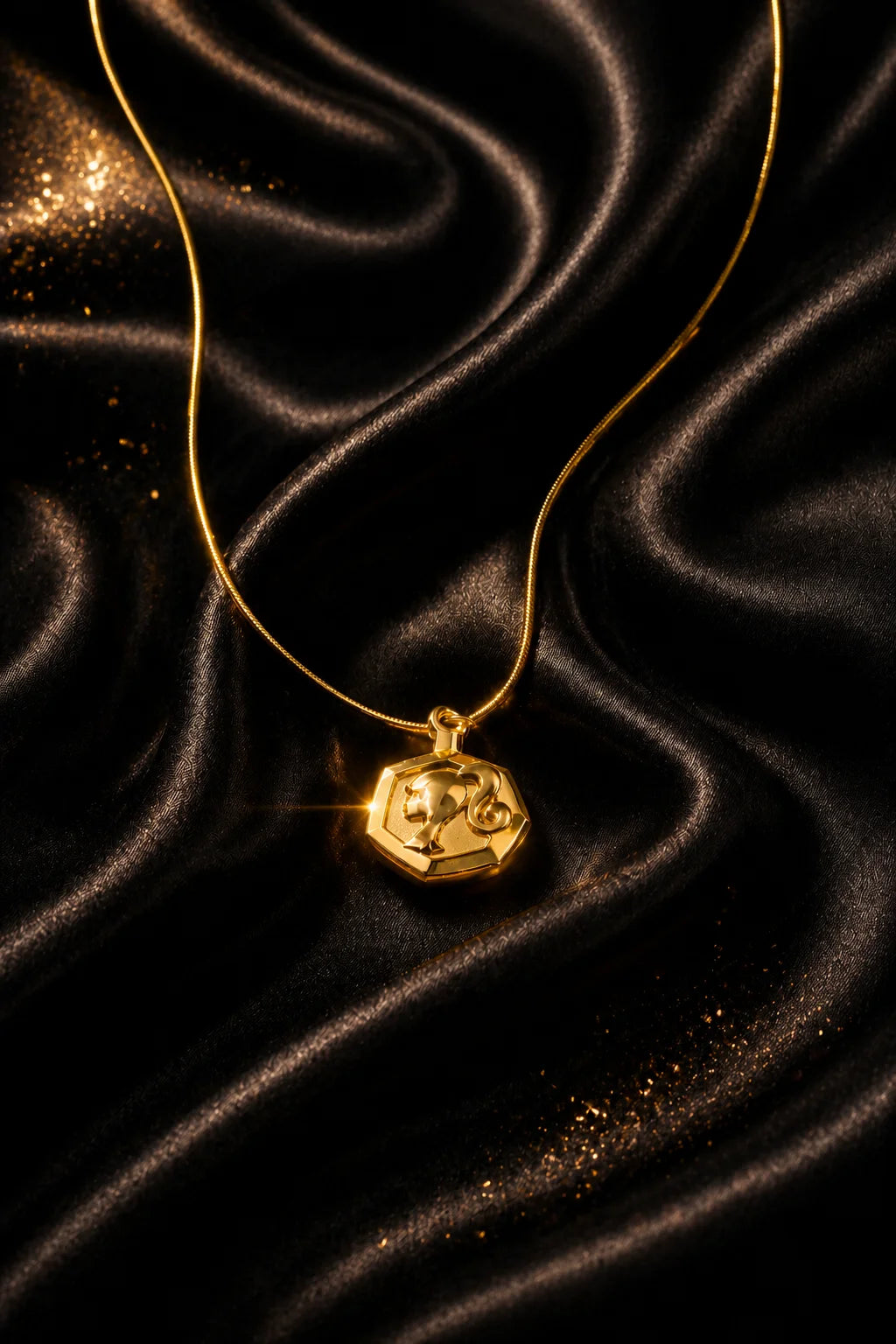 Gold-tone heart pendant necklace with small framed charm on thin chain