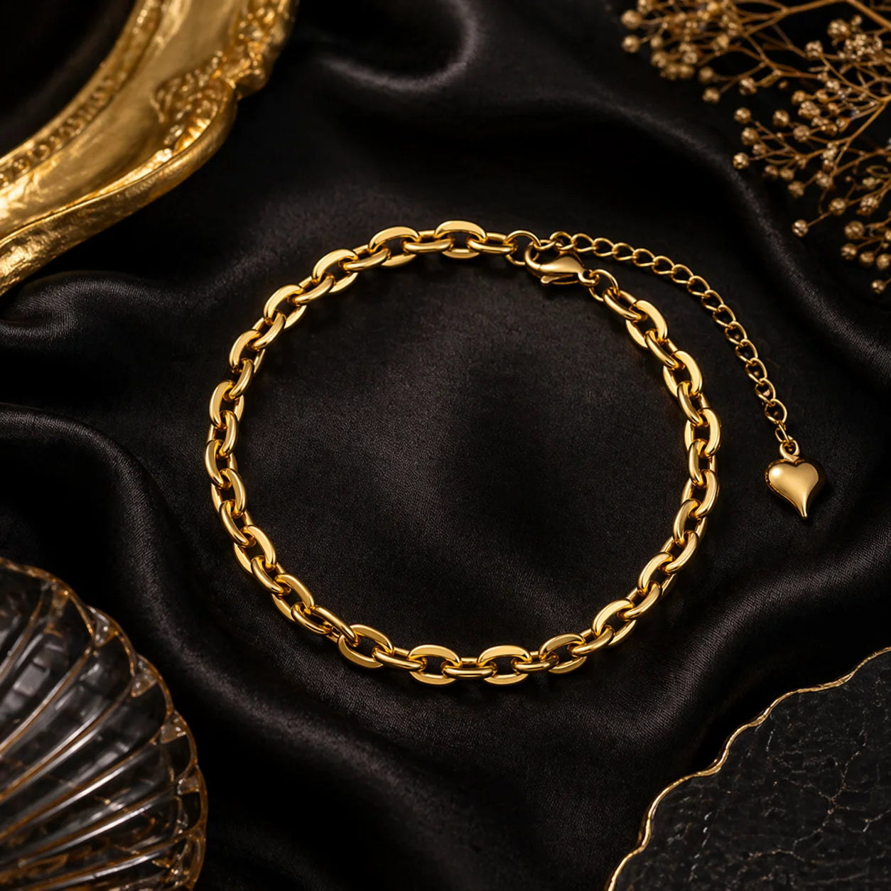 Gold link bracelet with heart charm, curb-style chain links