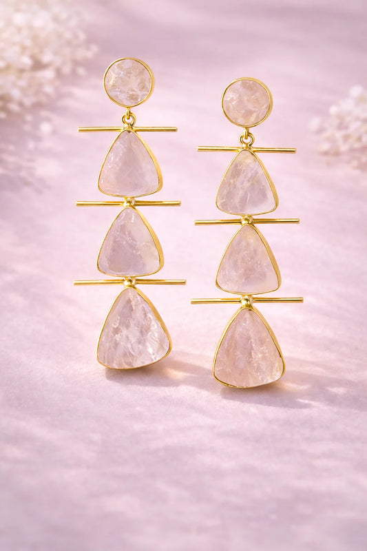 Gold drop earrings with raw rose quartz and bar links, three teardrop stones each