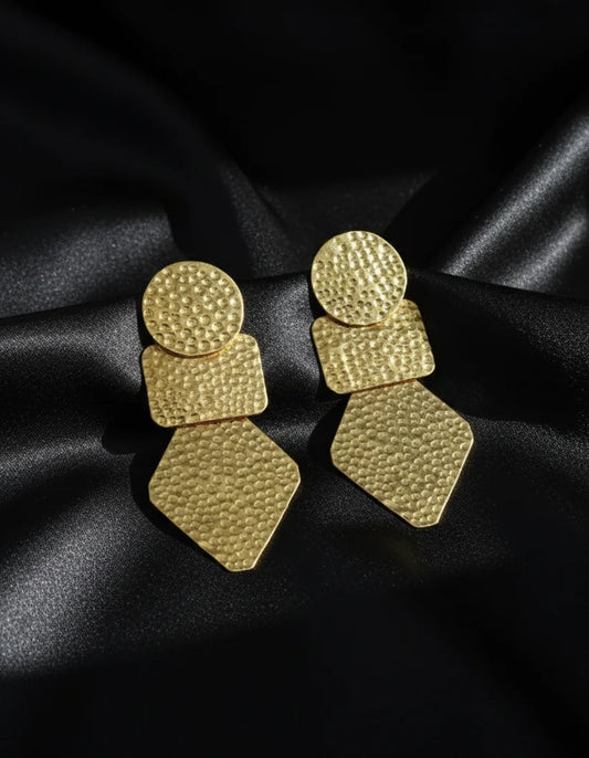 Gold textured statement earrings with layered circular and teardrop geometric drops