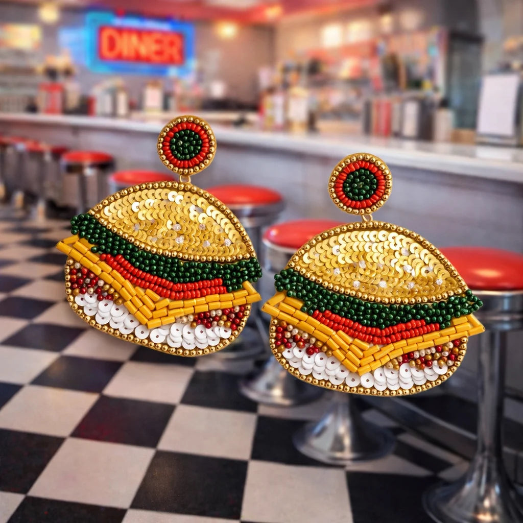 Burger-shaped beaded earrings: gold bun, green lettuce, red stripe, white bead accents
