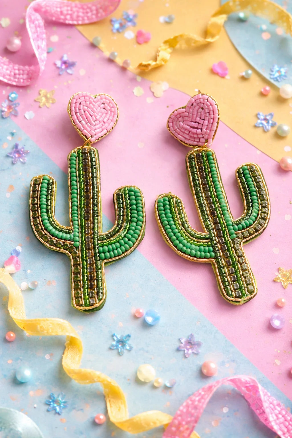 Beaded cactus earrings with pink heart tops and green bead bodies, gold trim