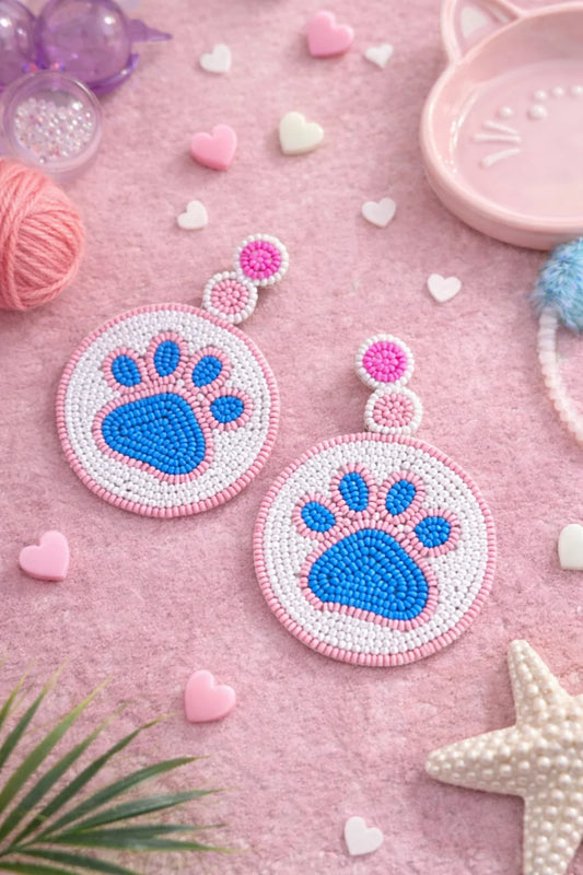 Beaded dog paw print earrings with blue paw centers and pink bead borders