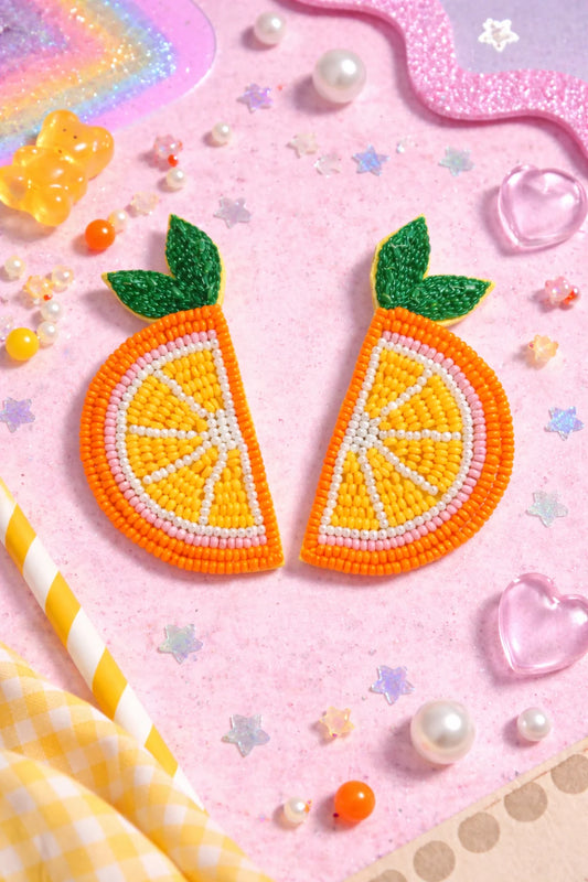 Orange beaded fruit-shaped earrings with green leaf tops, triangular design