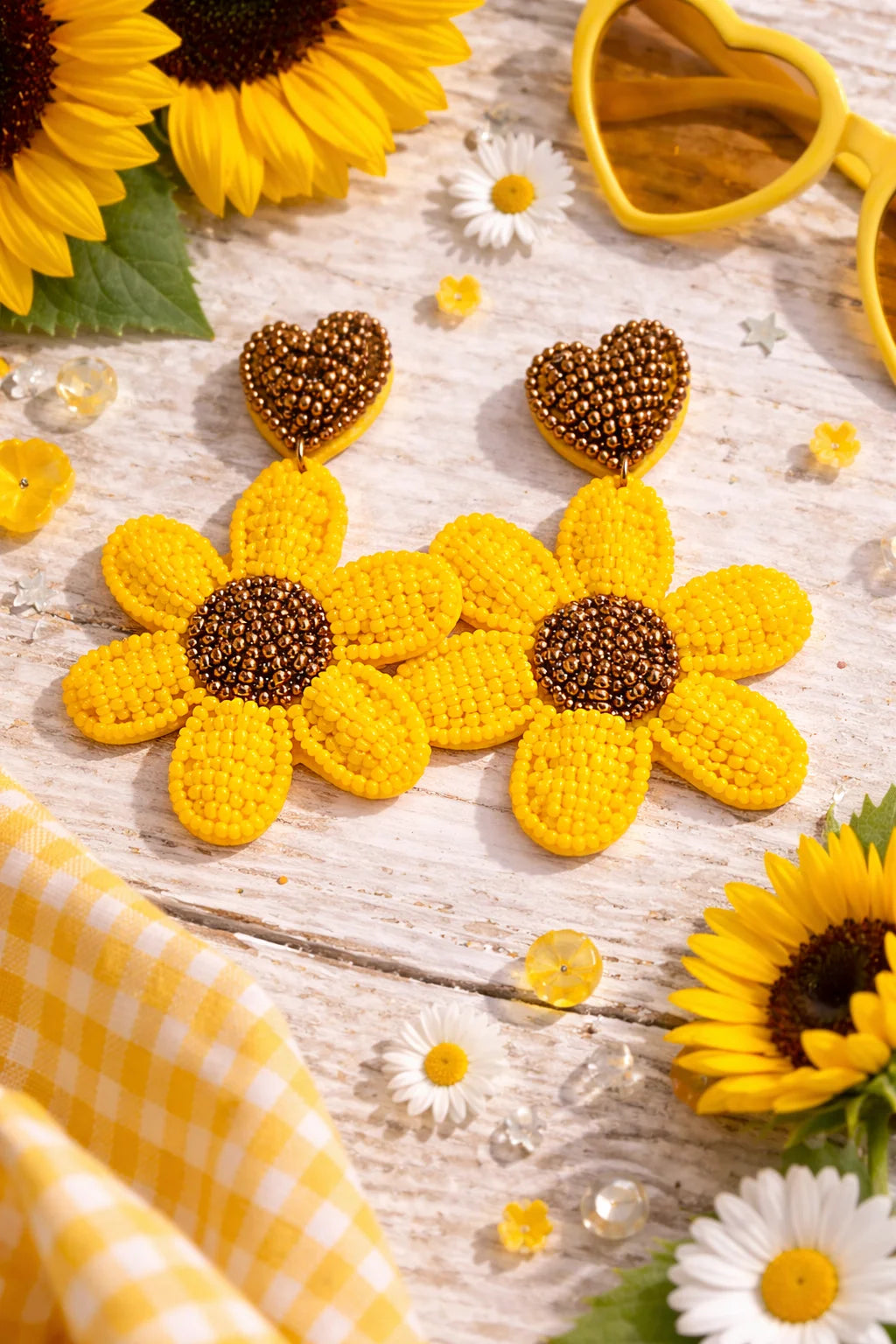 Beaded heart-and-sunflower drop earrings with yellow petals and dark beaded tops