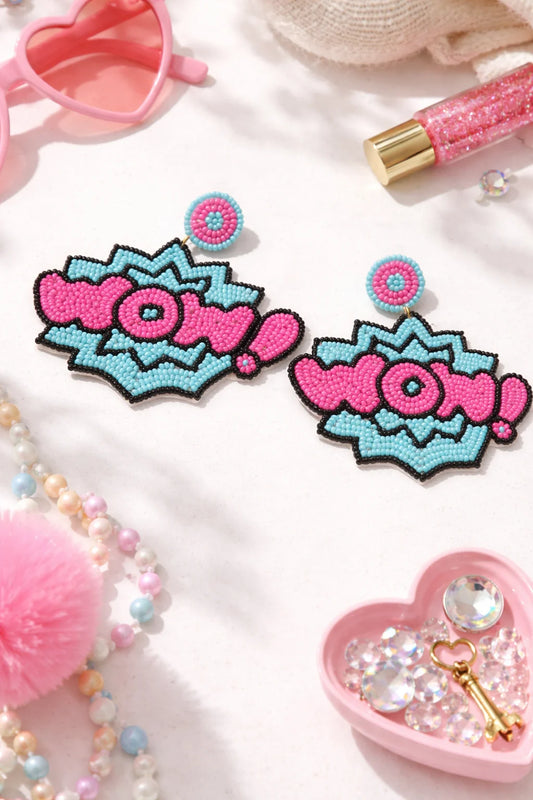 Pink and turquoise beaded pop-art heart earrings with circular eye detailing.