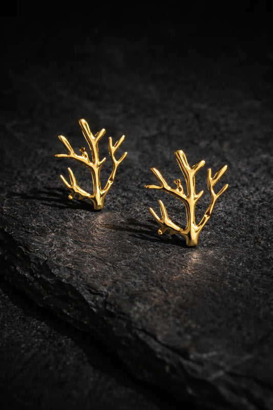 Gold-tone antler stud earrings with curved branch design
