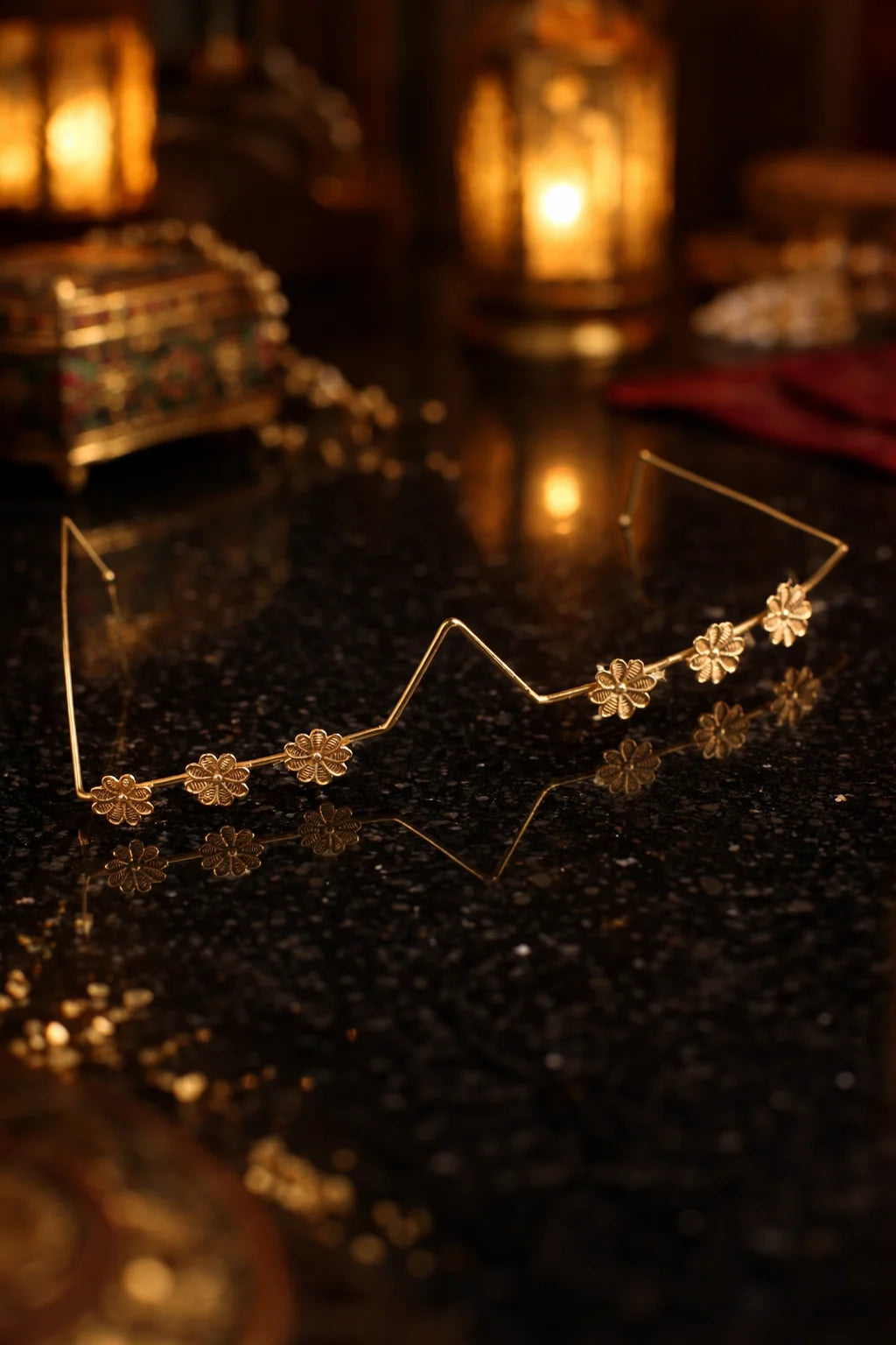Floral inline facelet with gold-tone metal band and small flower accents