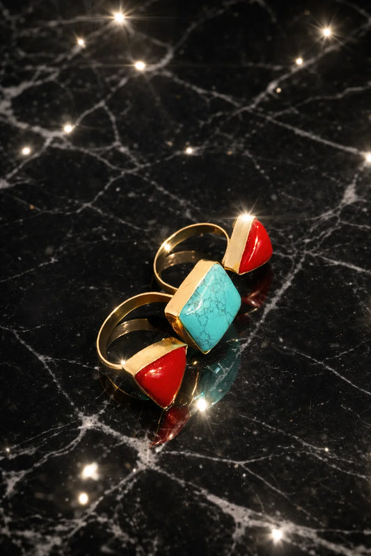 Statement ring with turquoise square stone and red triangular accents on gold band