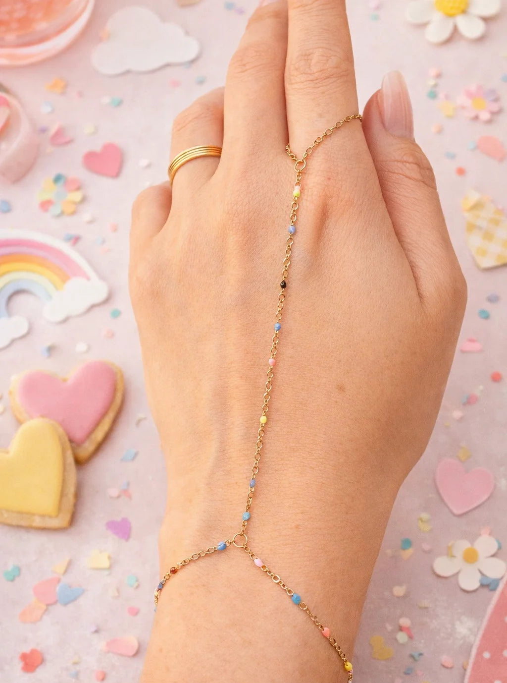 Gold-tone hand chain with multicolor bead strand and small round clasp