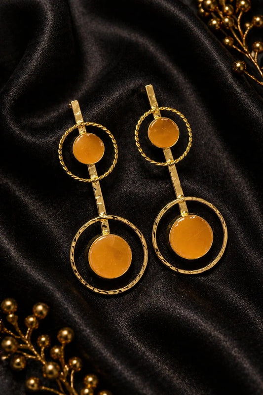 Gold-tone drop earrings with circular halo rings and orange round stone accents
