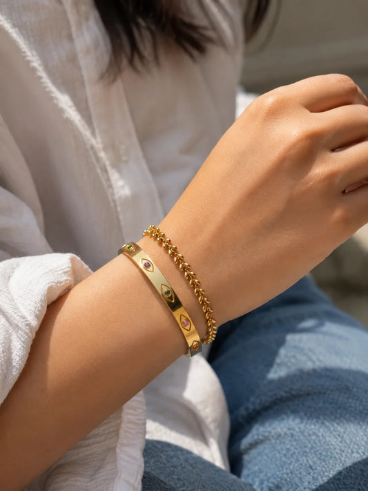 Gold beaded bracelet with multicolor oval charms and chain link