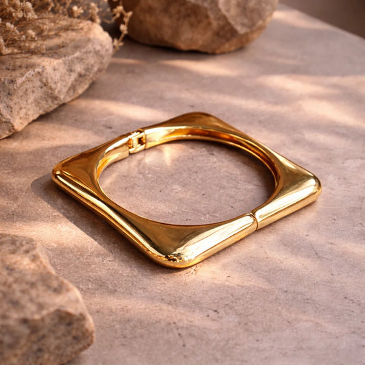 Chunky square kada bangle, glossy gold-tone with polished open frame