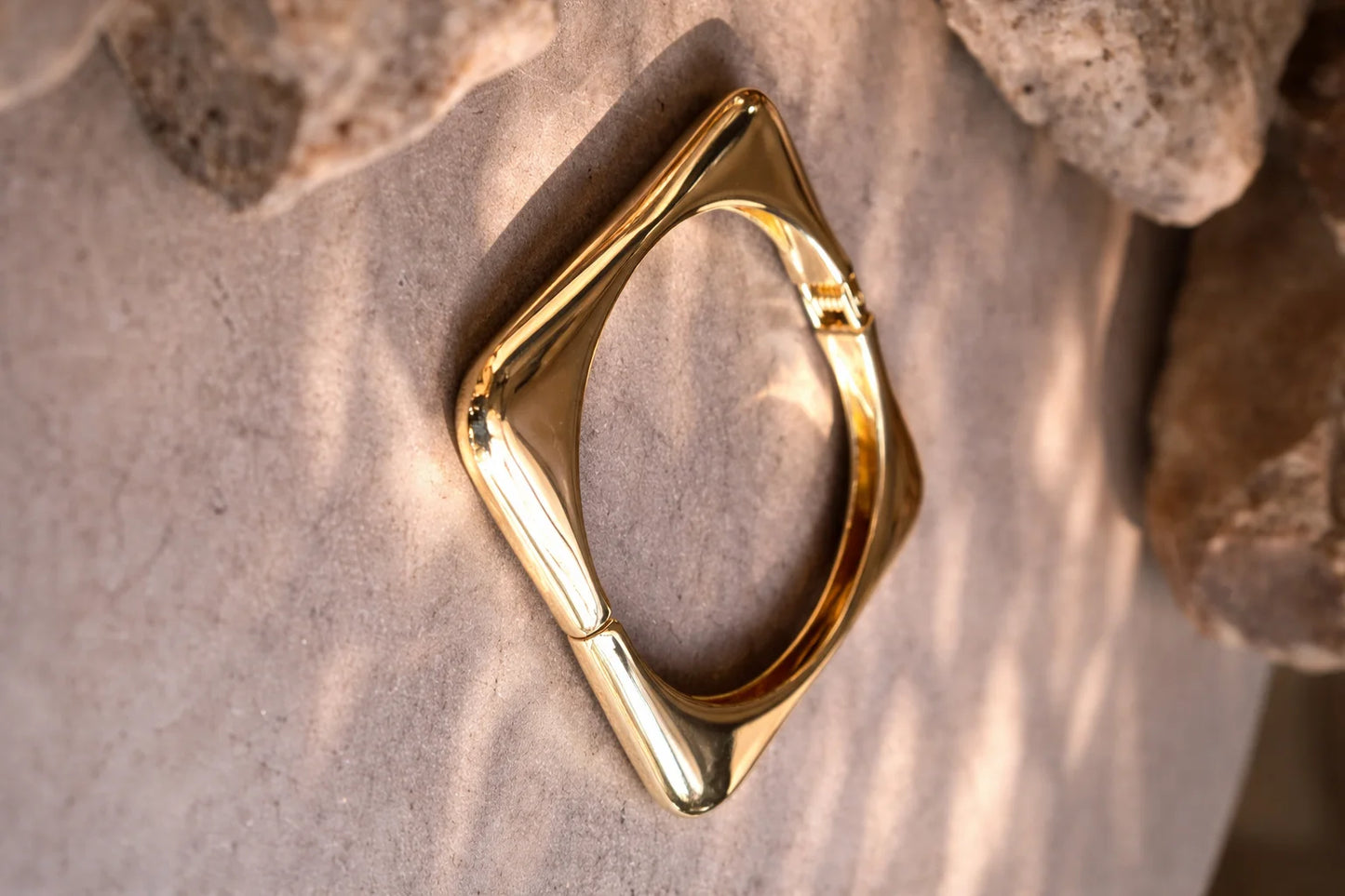 Chunky square kada bangle, glossy gold-tone with pointed-corner open frame