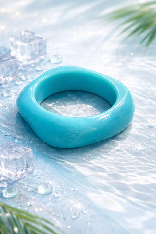 Sky blue resin kada bangle, glossy wide cuff style.