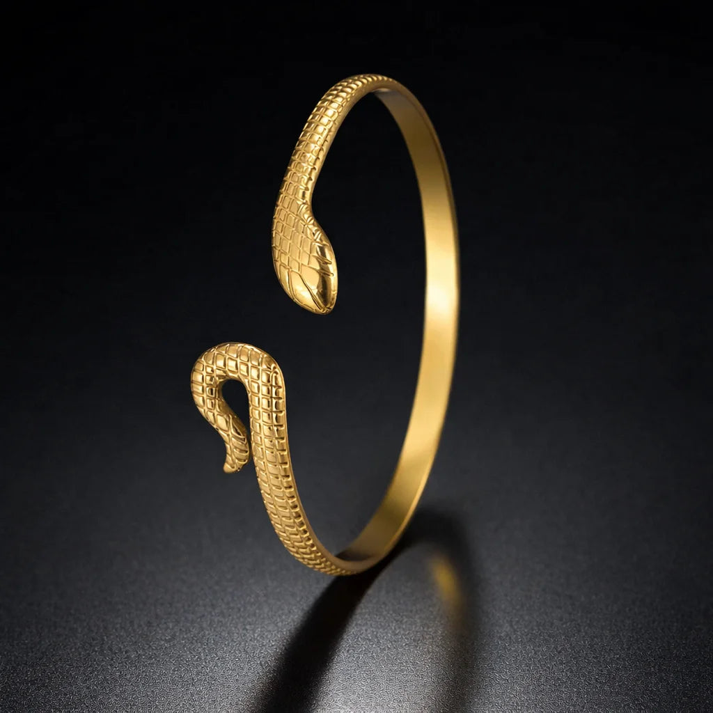 Gold snake bangle kada with textured scales and coiled head open cuff