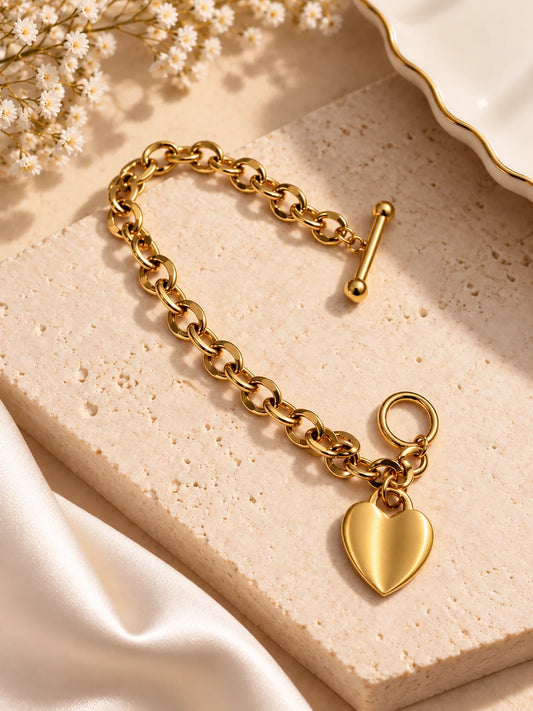 Gold tone chunky chain bracelet with heart charm and small keyring clasp