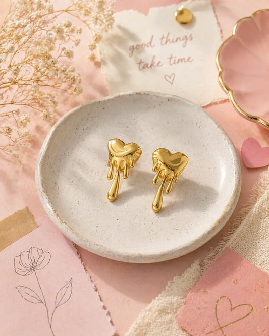 Gold heart statement earrings with drips, stud-style, dangling heart drops