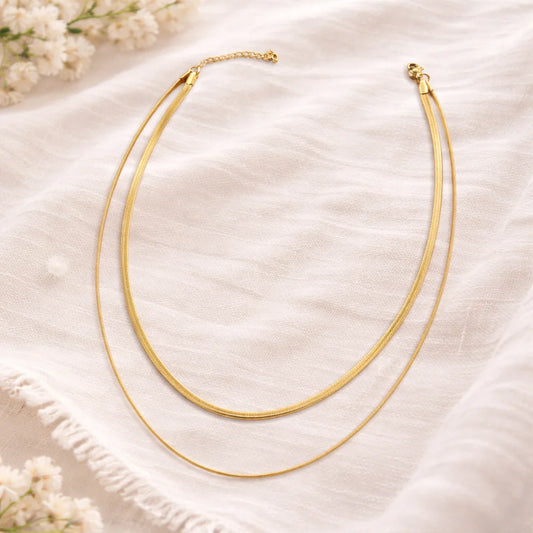 Layered snake chain necklace set with two gold-tone strands