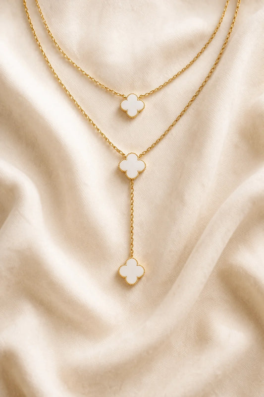 Double-layer clover drop necklace with gold chain and three white clover charms