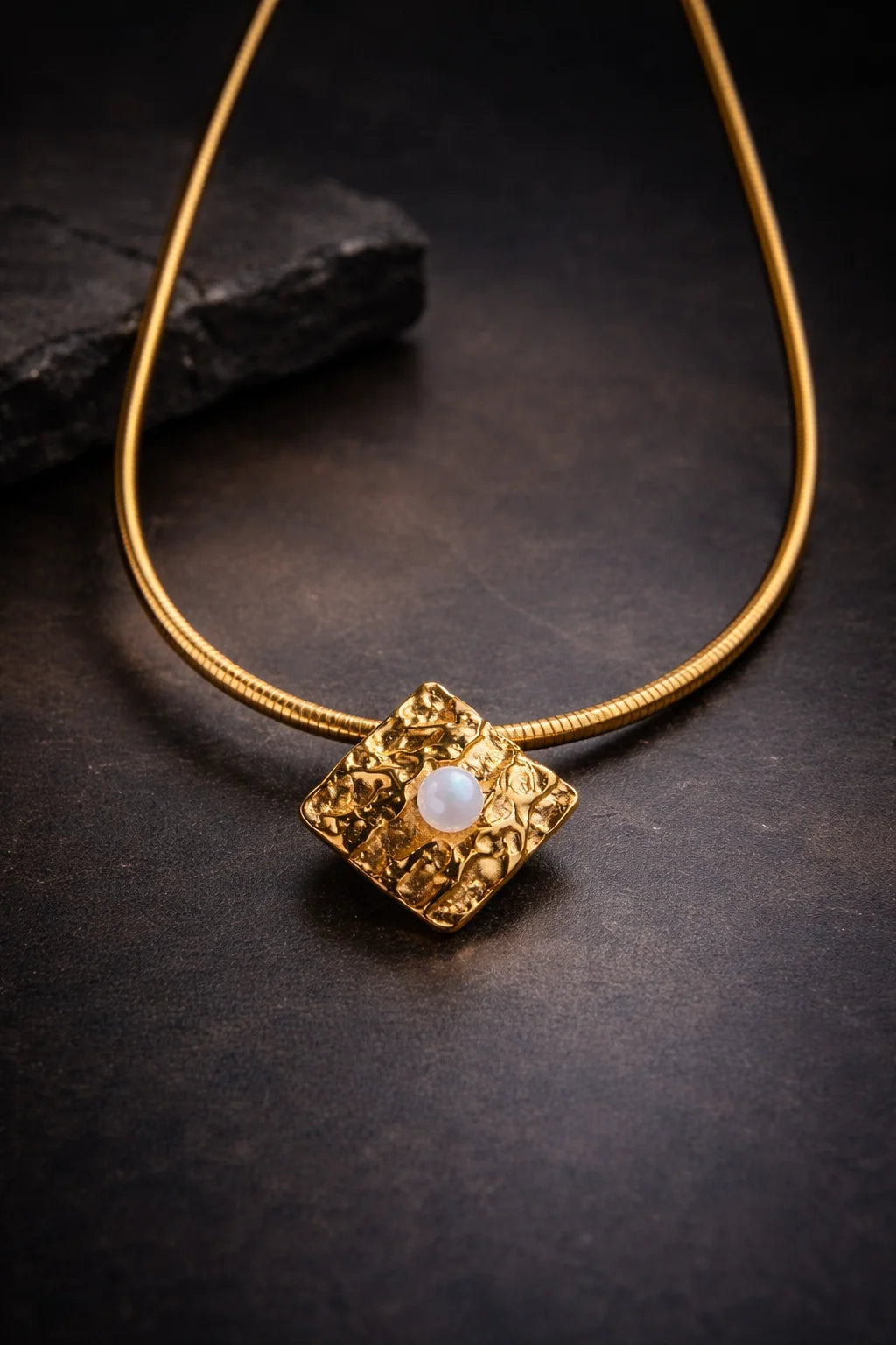 Gold statement choker with pearl drop pendant