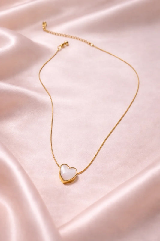Gold-tone necklace with heart pendant and pearl-look white stone