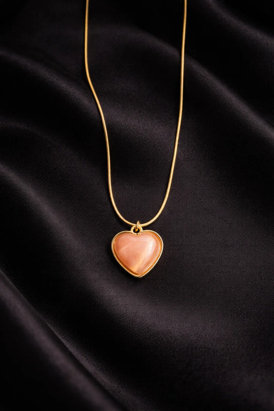 Sundowner heart necklace with gold chain and pink heart pendant, gold frame