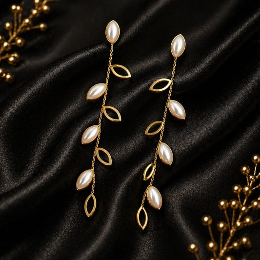 Gold-plated statement earrings with leaf drops and pearl-like teardrops