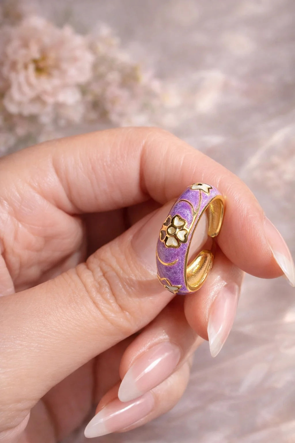 Purple enamel band ring with gold-tone flower and swirl detailing