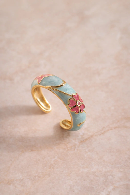 Enamel flower ring with gold-tone band, sky-blue enamel and pink floral detail