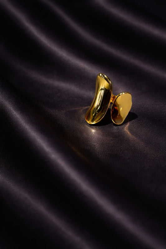 Gold abstract art ring with curved oval open-back design