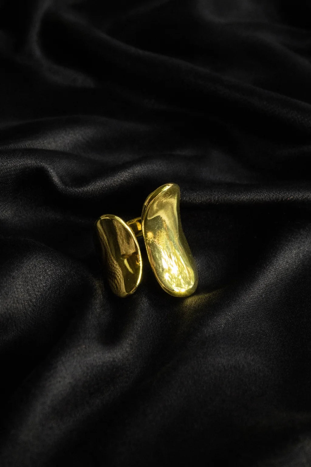 Gold abstract art ring with two stacked curved oval pieces