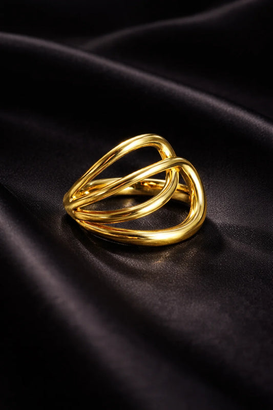 Gold-tone double-layer ring with two interlocking oval loops, high shine finish