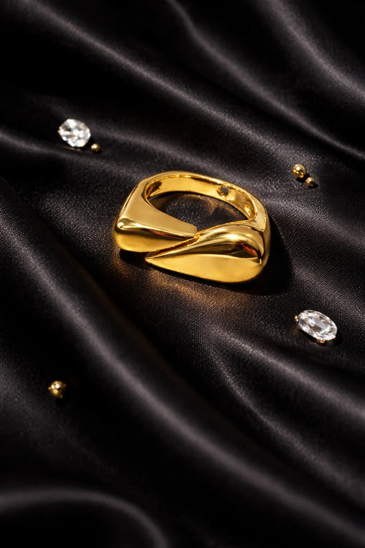 Gold-tone sculpted hug ring with teardrop openings