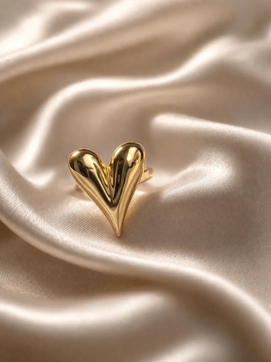 Heart-shaped statement ring with glossy gold tone finish
