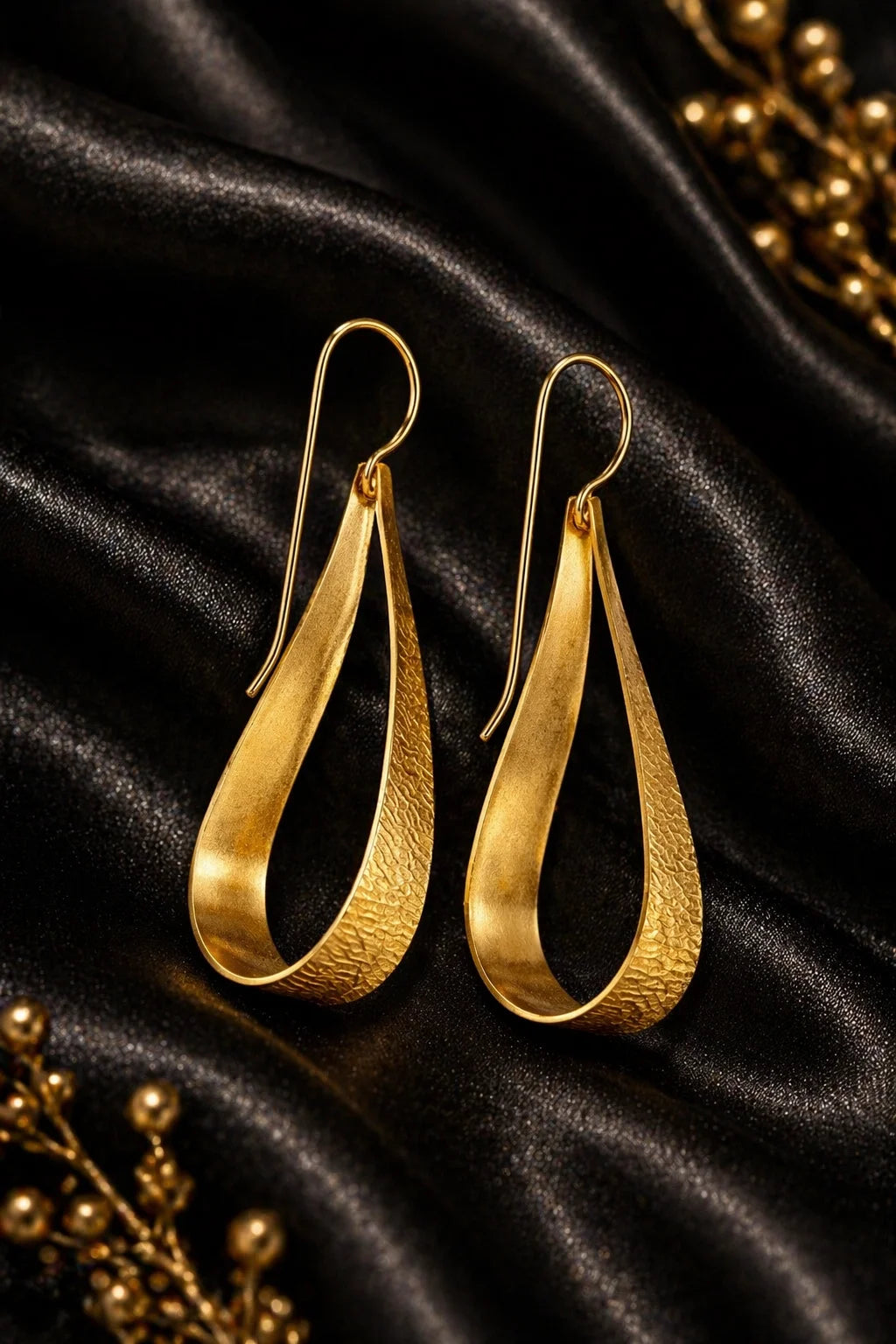 Gold-tone sculpted teardrop loop earrings with hooked ear wires, pair.