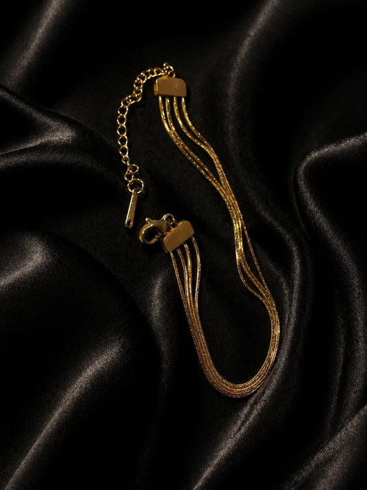 18K gold-plated soft stack bracelet with three layered chain strands and clasp