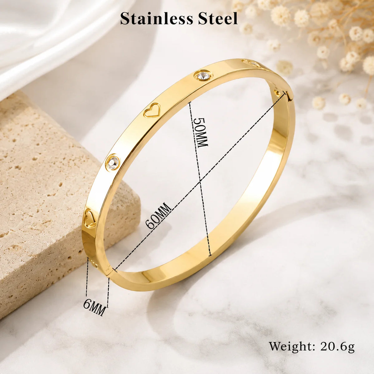 Gold-tone stainless steel kada bracelet with heart and clear crystal accents